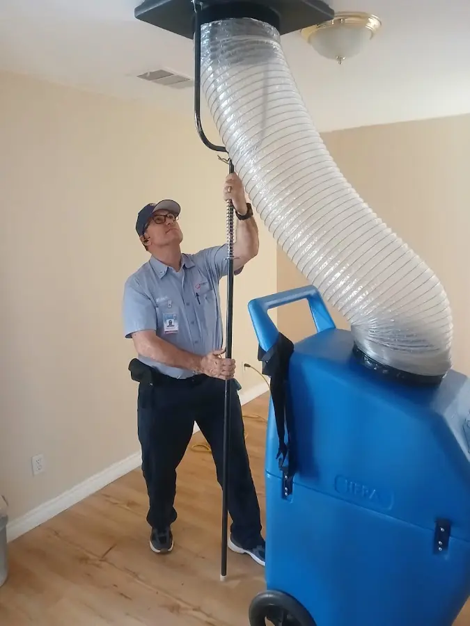 Furnace Tune-Up technician using HEPA equipment in College Park
